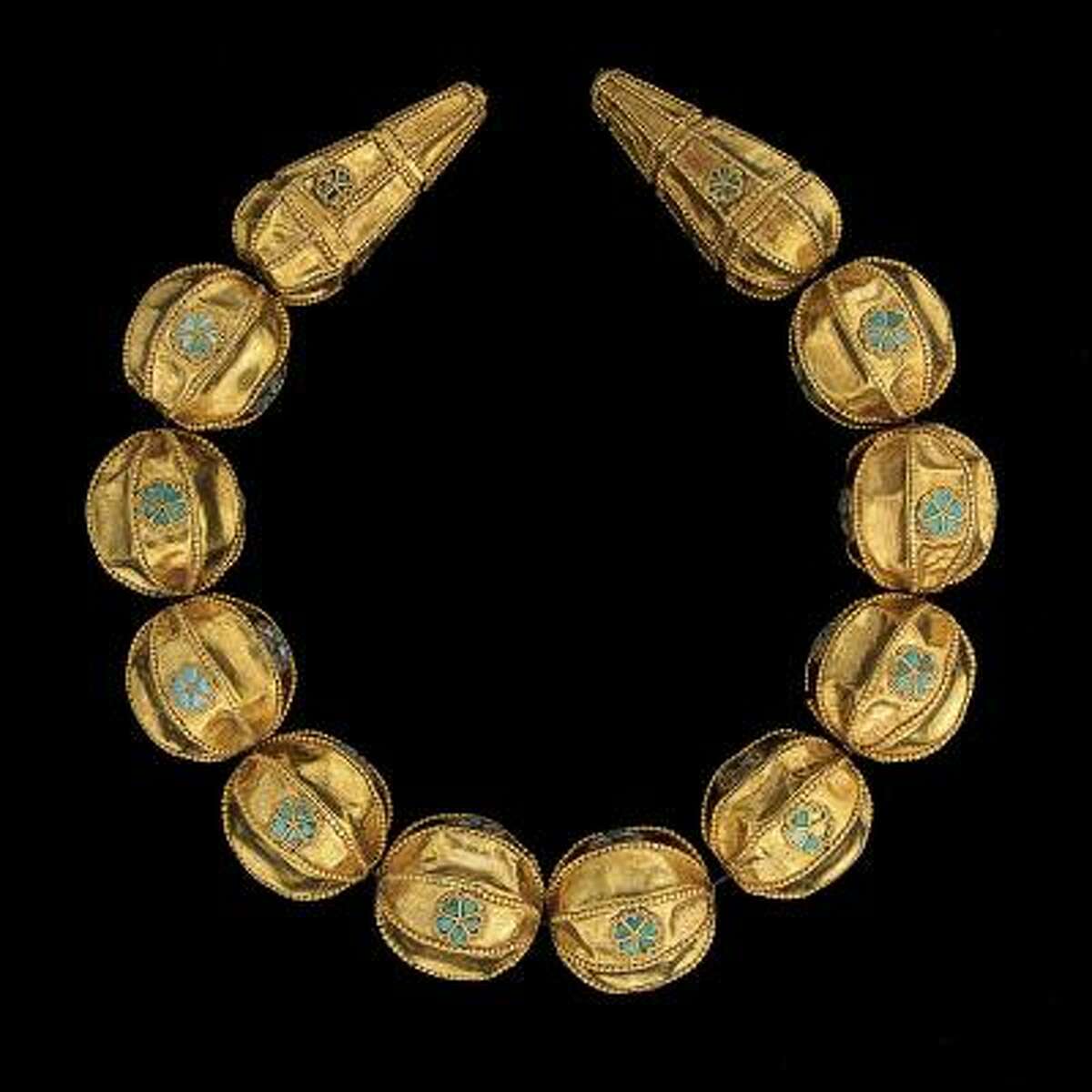 Necklace with granulated gold beads inlaid with turquoise found in the principal female burial excavated by Viktor Sarianidi in 1978. Early 1st century A.D. Gold, turquoise.