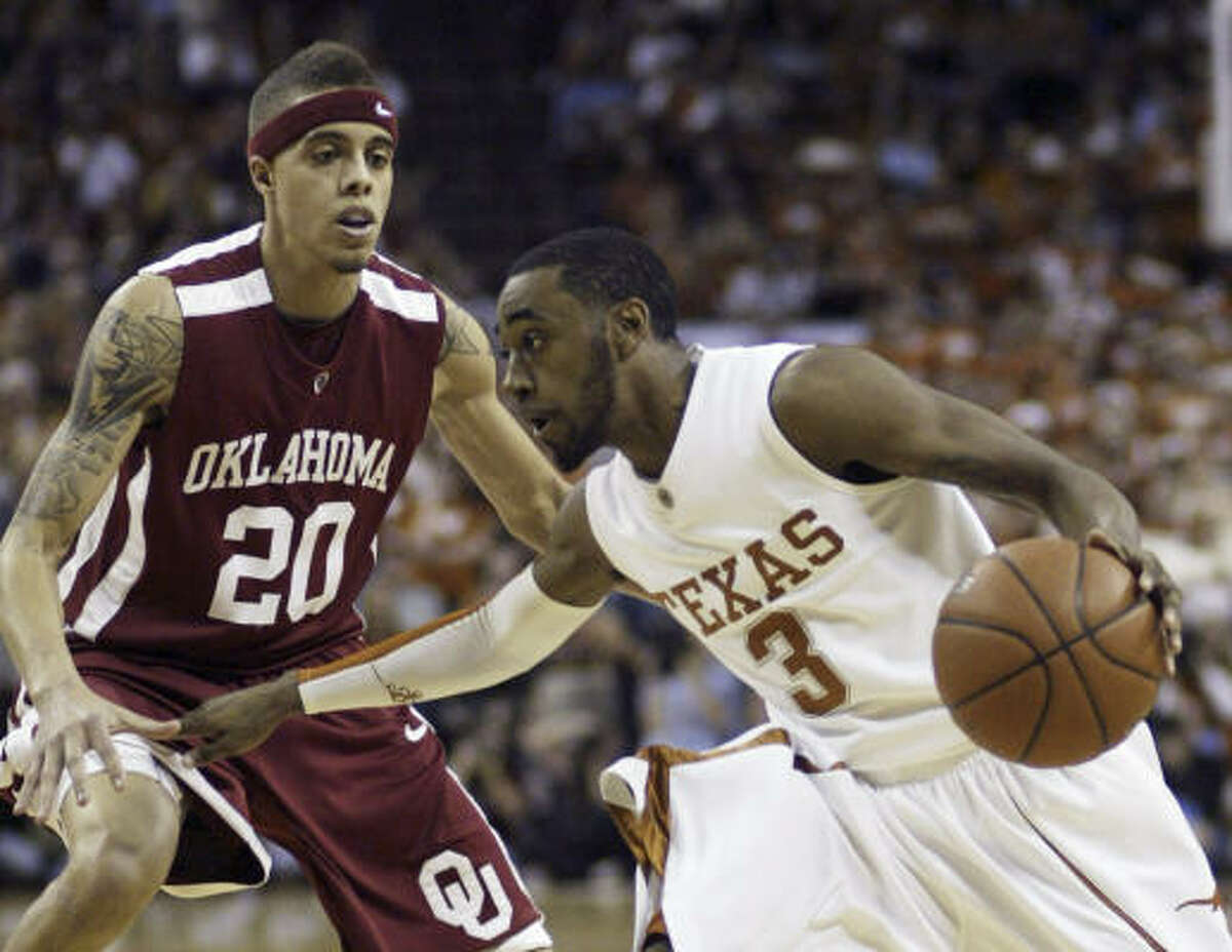 Texas 73, Oklahoma 68 Texas guard A.J. Abrams, right, looks to drive to the basket as Oklahoma guard Austin Johnson, left, defends during the second half. Abrams' team-high 23 total points helped lead Texas to the upset over the second-ranked Sooners.