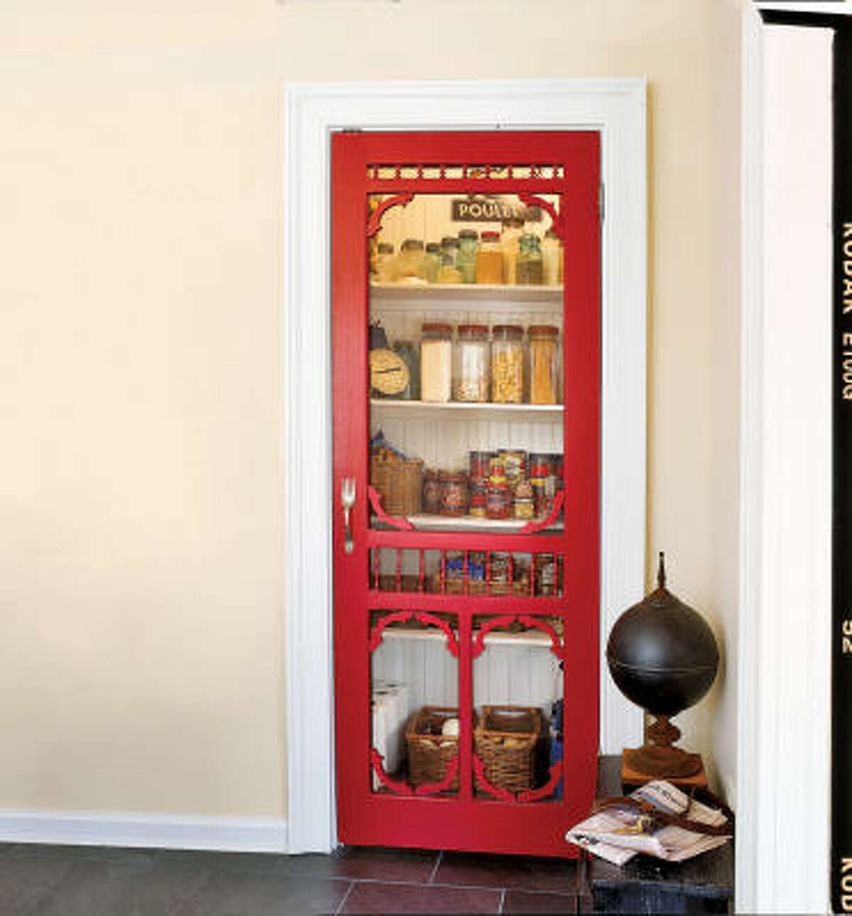 A painted screen door in a kitchen pantry becomes an interesting design element.