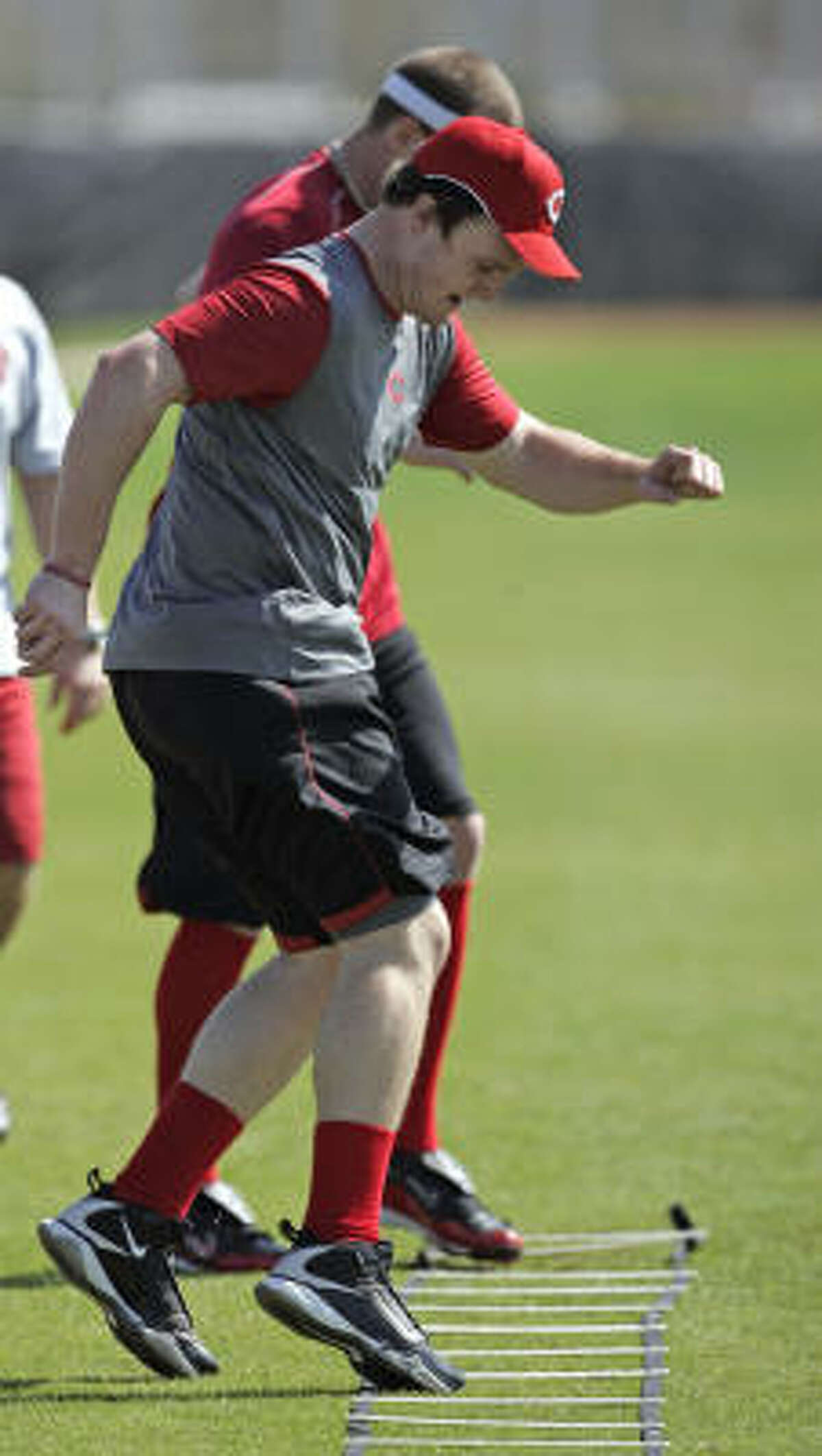 Cincinnati Reds' Jay Bruce goes through drills during spring training.