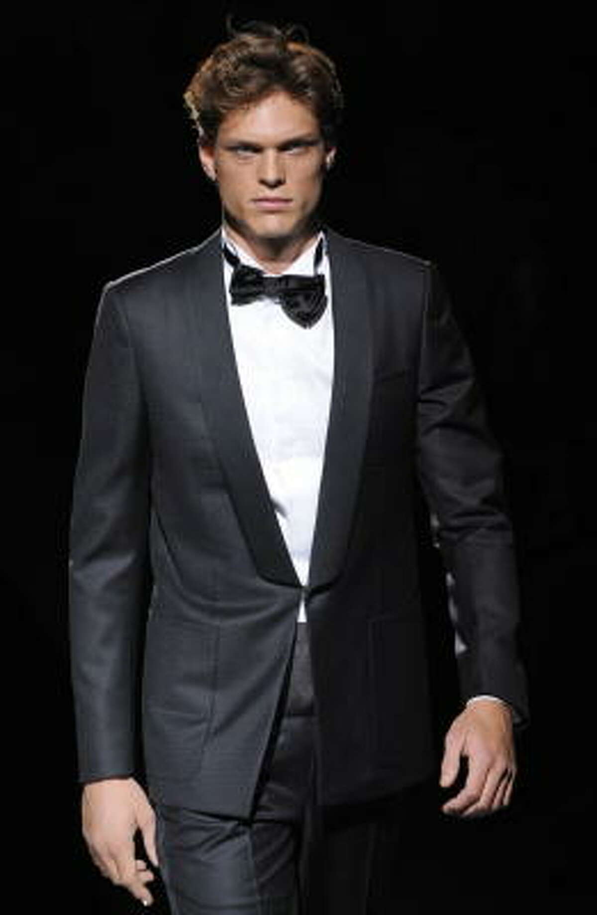 Black tie optional implies that you can choose between a tuxedo or a suit, but it really means a tux.