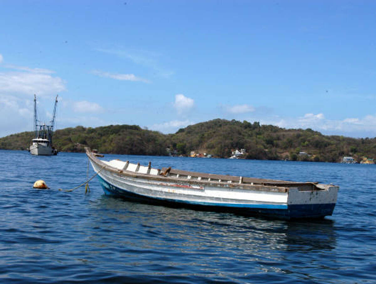 Boats bob on the bay near the Gasparee Island caves. Gasparee Island, also known as Gaspar Grande, is one of a chain of five islands situated just off the Western Peninsula of Trinidad (better known as "Down the Islands.")