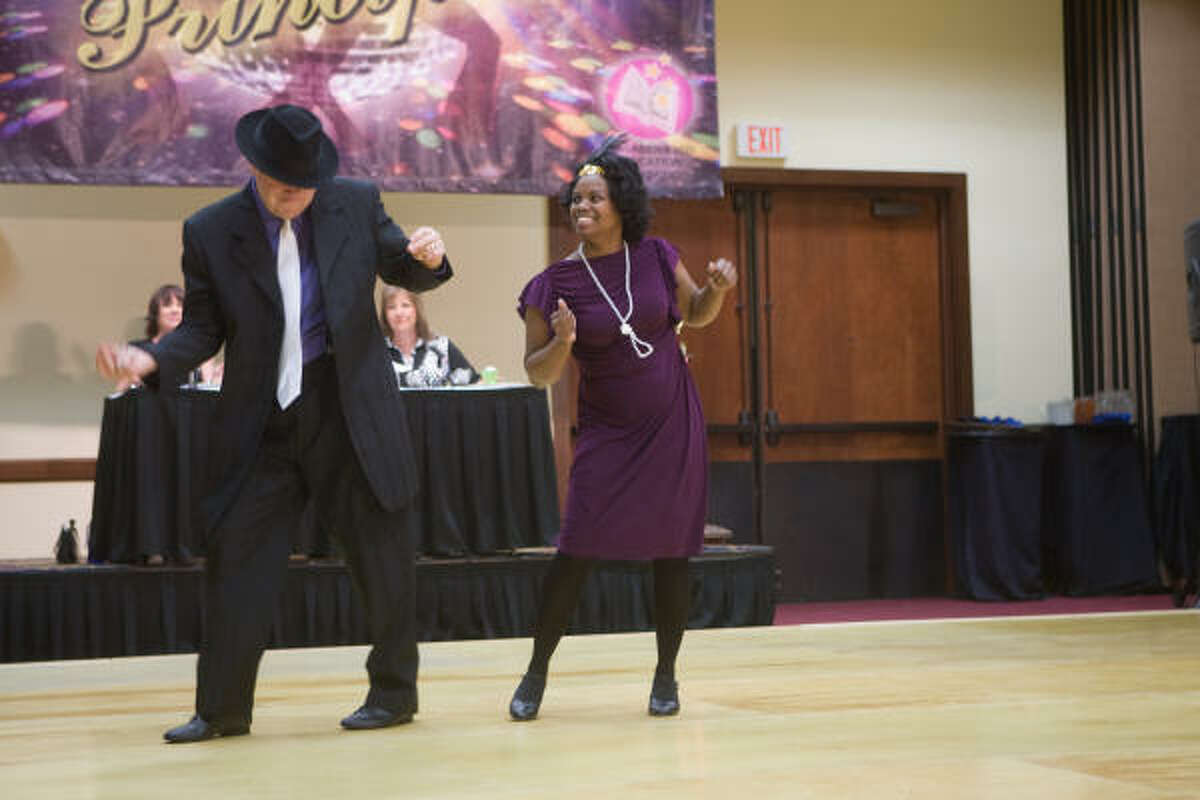 PISD Superintendent Kirk Lewis and Graphic Designer LaVonna Alexander-Carew start the party with an exhibition at Pasadena ISD's "Dancing with the Principals" fundraiser.
