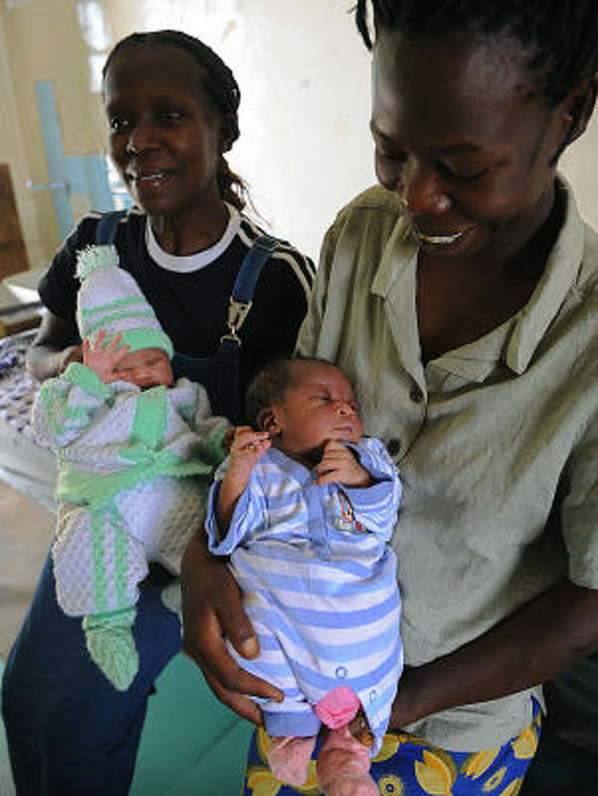 Kenyan mothers Linda Omondi, with baby Michelle Obama, left, and Caroline Akinyi, with baby Barack Obama, carry their newborns named after the new president and first lady on Jan. 21 at the new Nyanza general hospital in Kisumu. They were born moments after the inauguration. Kisumu city is a western lakeside town about an hour drive from the village where Obama's father was born.