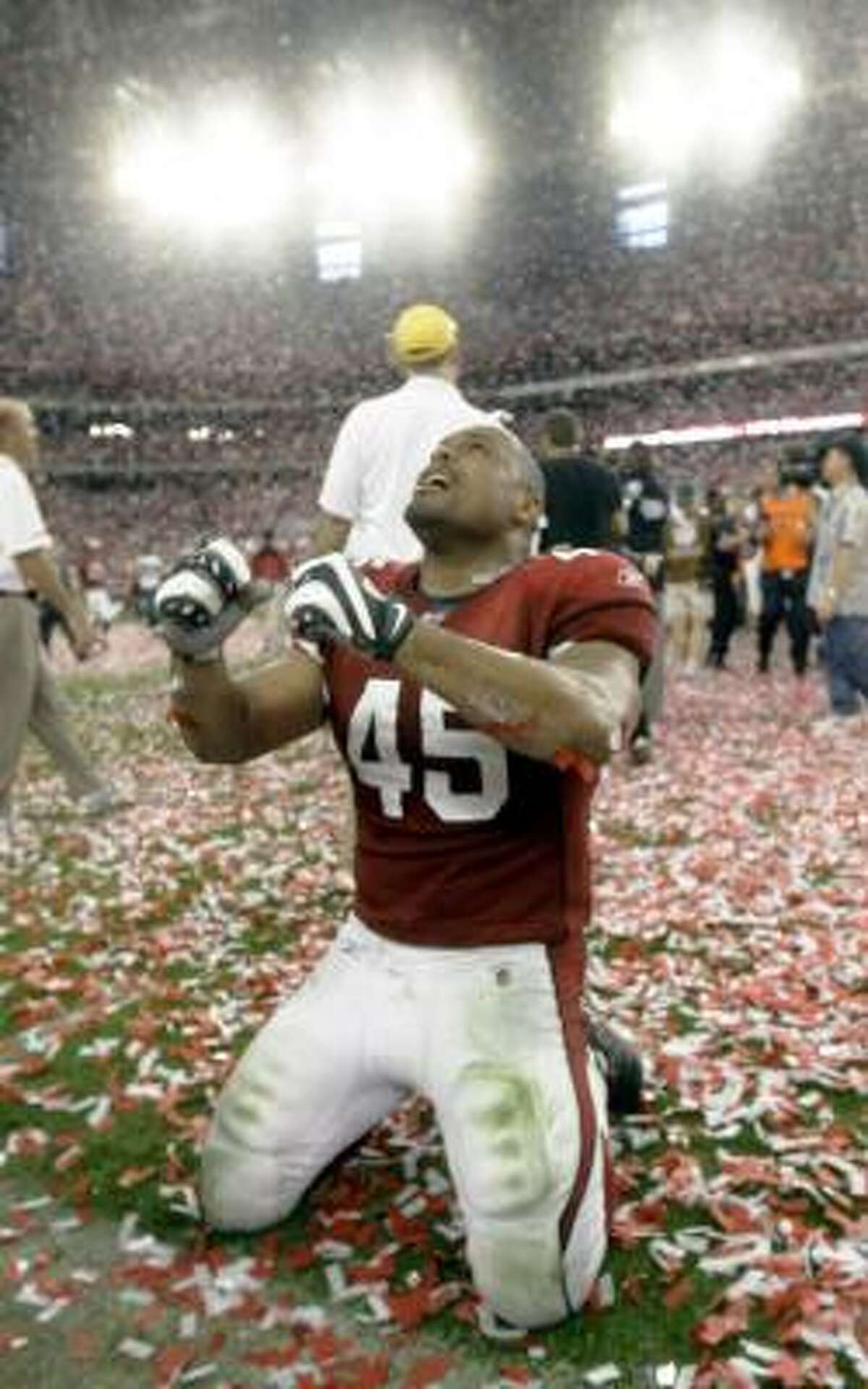 Cardinals fullback Terrelle Smith is showered in confetti after his team's victory in the NFC championship game.
