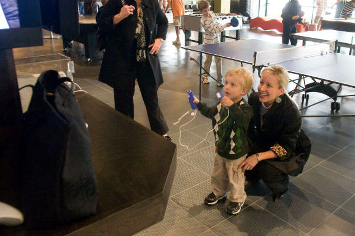 Noah Brown, 4, plays with a skiing video game.