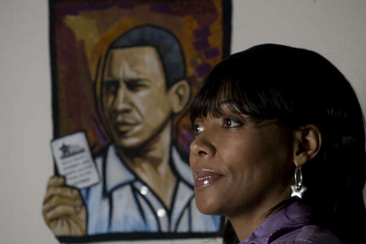Carolyn Crump poses for a portrait with one of her quilt pieces. Crump's quilt is in "Quilts for Obama: An Exhibit Celebrating the Inauguration of Our 44th President."
