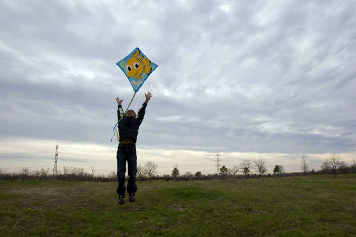 Kush Patel, 5, was one of hundreds of local Hindu children and adults flying kites as more than 2,000 local Hindus celebrated during Sankranti, at George Bush Park in Houston.
