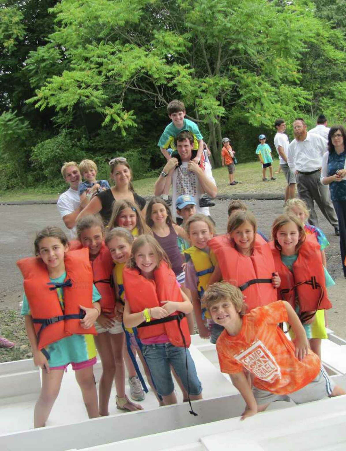 Children enrolled in Camp Gan Israel of Westport made their way onto the Saugatuck River Wednesday afternoon in boats they built themselves with instruction from Curtis Tucker, founder of Kids Aboard Workshops, Inc. In this photo, children pose for the camera minutes before boarding their boats.