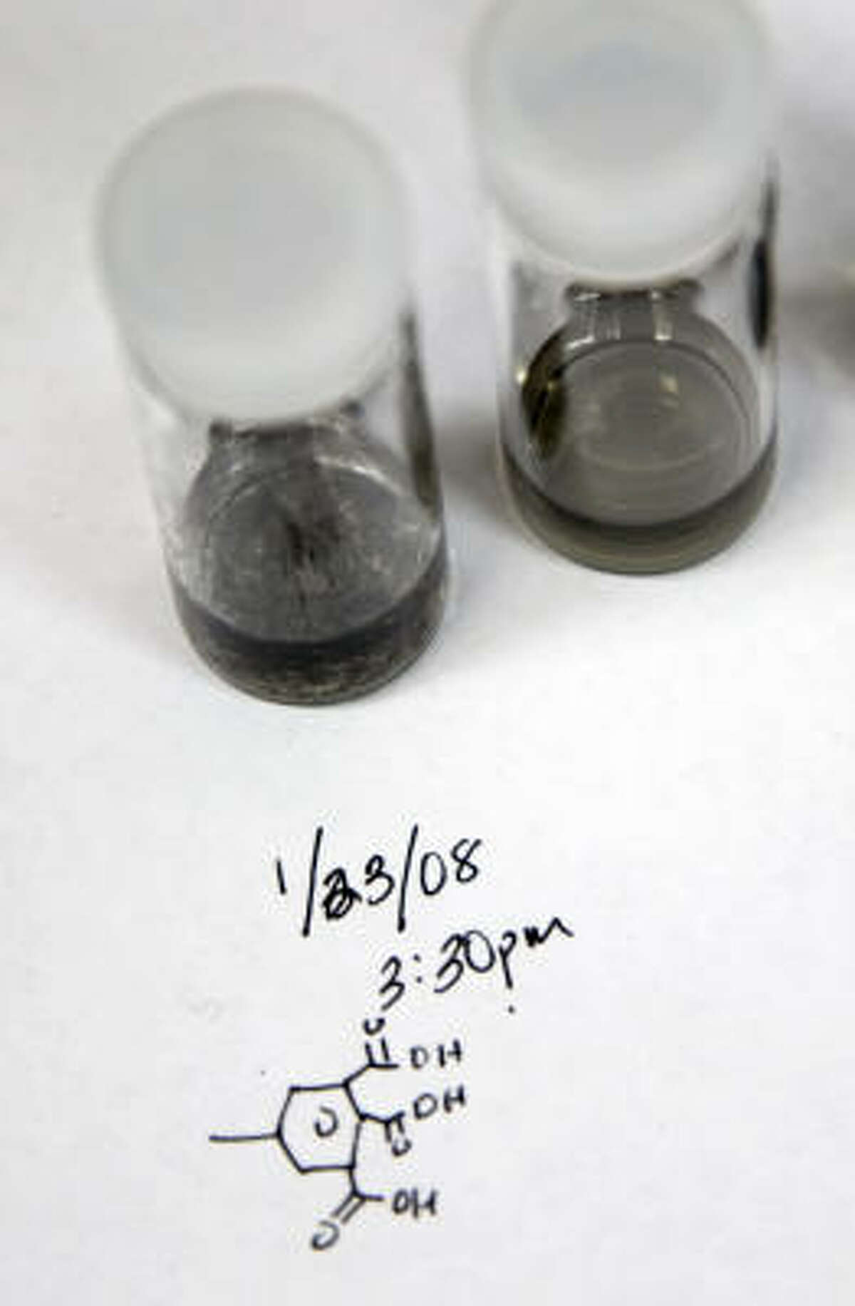 Two sample of nanotubes, one suspended in liquid, right, and one out of suspension at left, are seen in Jim Tour's lab at Rice University.