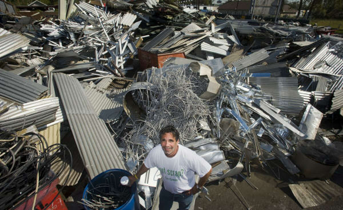 Owner Dennis Laviage ran his business, C&D Scrap Metal, despite not having electricity for two weeks after Hurricane Ike, seen here in 2007.
