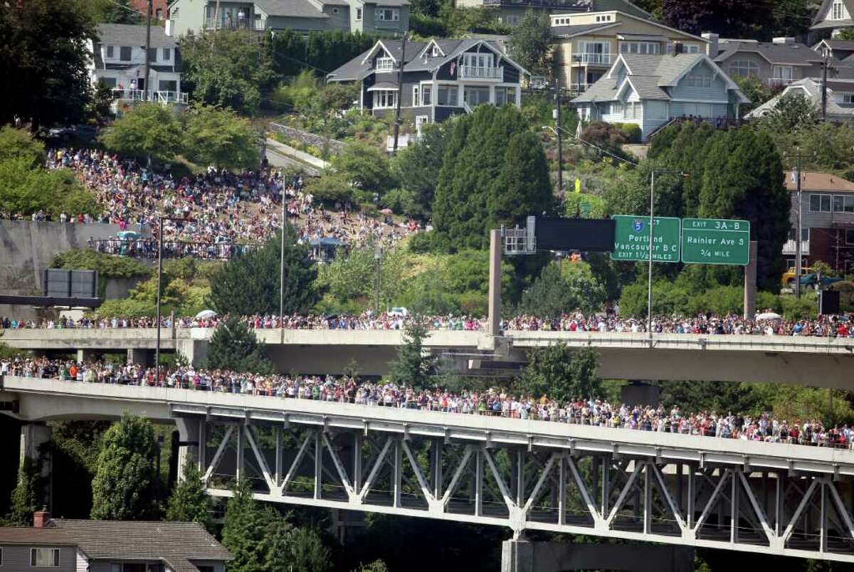 A large crowd forms on the west side of Interstate 90 to watch the Blue Angels perform on Sunday, Aug. 7, 2011.
