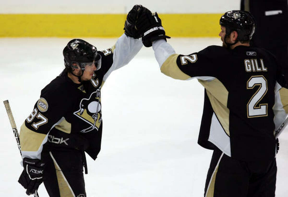 Hal Gill and Sidney Crosby note a 1-0 series lead.