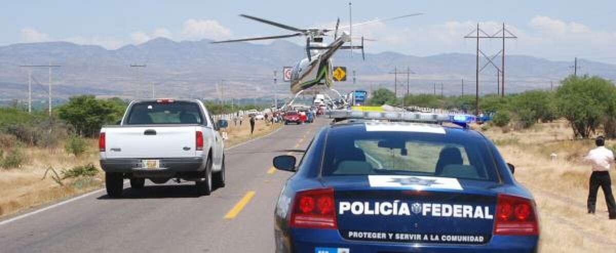 Mexico's federal police secure the scene of a shootout in Vicente Guerrero, Durango, considered territory of the Federation cartel.