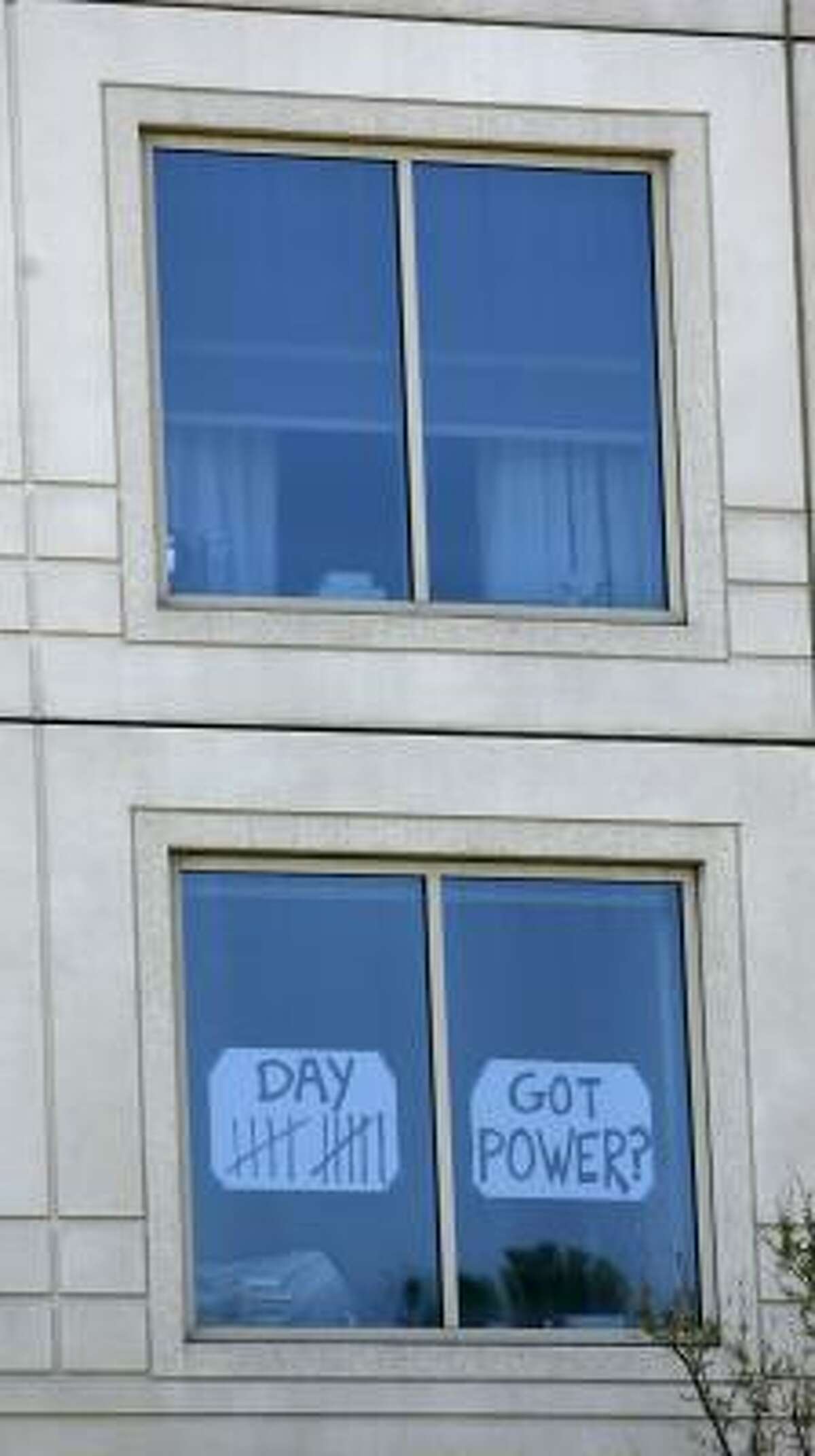 A sign in a window of a high-rise on Allen Parkway expresses the frustration of many in the same situation.