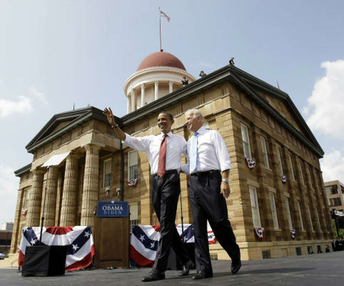 Democratic presidential candidate Sen. Barack Obama, D-Ill., walks with vice presidential running mate Sen. Joe Biden, D-Del., at a rally in front of the Old State Capitol in Springfield, Ill., on Saturday, Aug. 23, 2008.