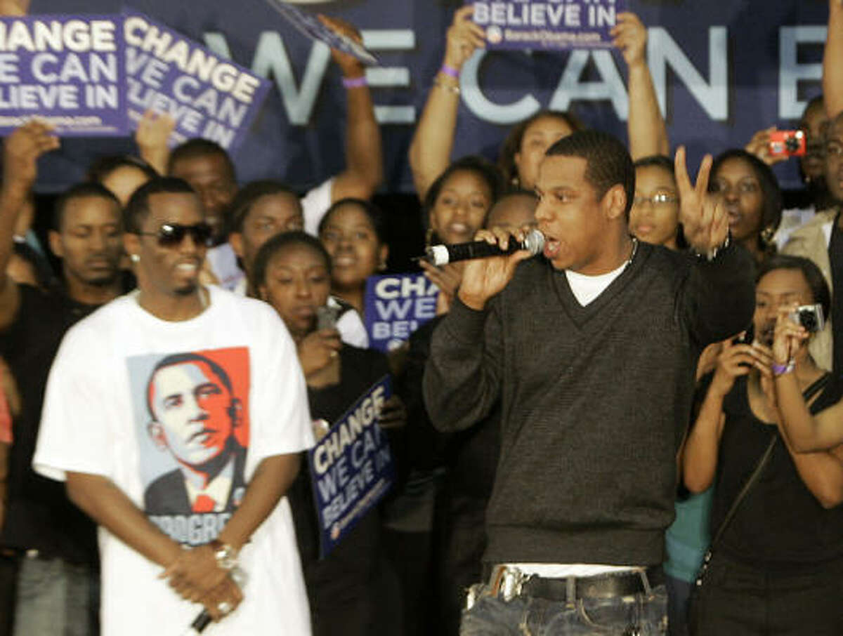 Hip hop stars Diddy, left, and Jay-Z urged the crowd at Florida Memorial University in Miami Gardens not to allow long lines at the polls keep them from voting.