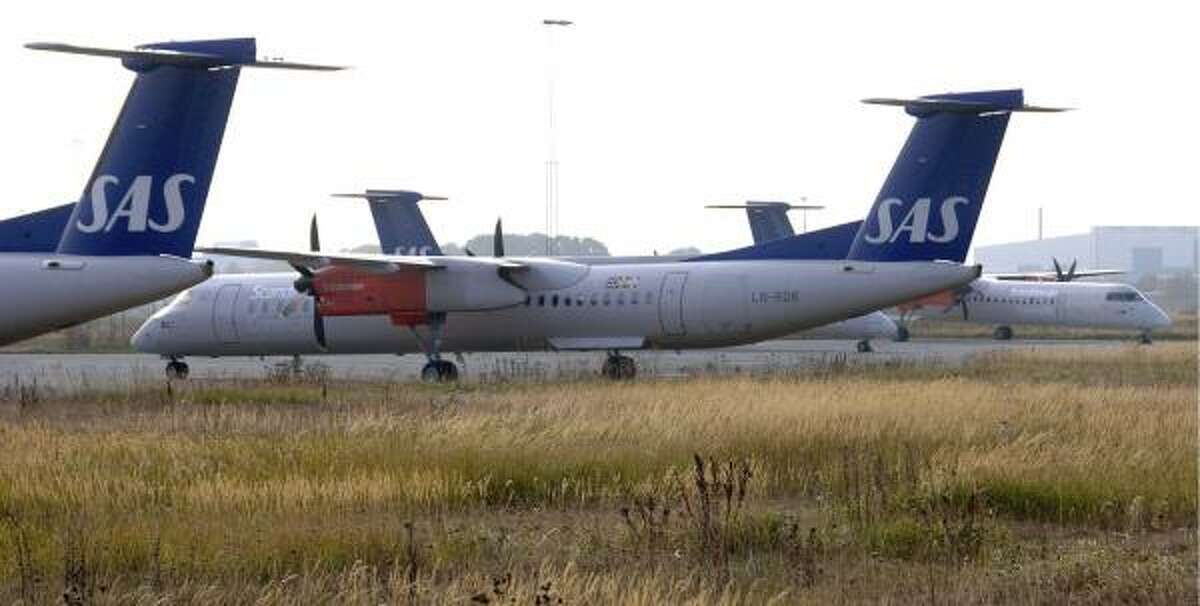 Scandinavian Airlines Bombardier Q400 turboprop aircraft are parked at Copenhagen's international airport. The turboprop is making a comeback in an era of soaring fuel prices.