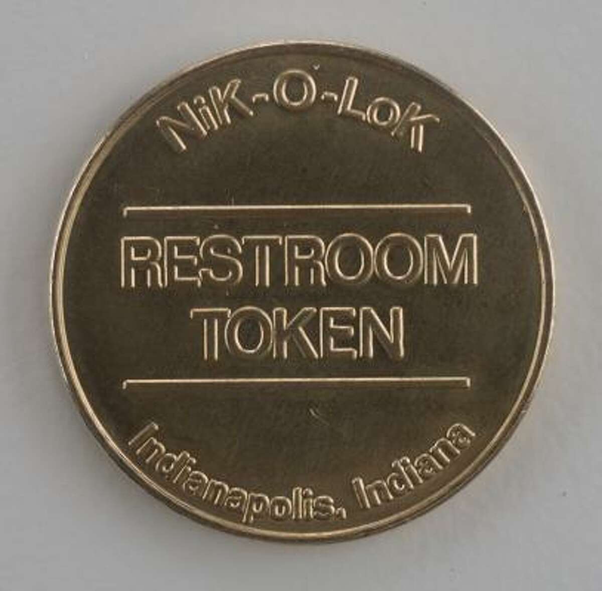 Customers at a Burger King in the Texas Medical Center must request a token or use a coin to open the restrooms.