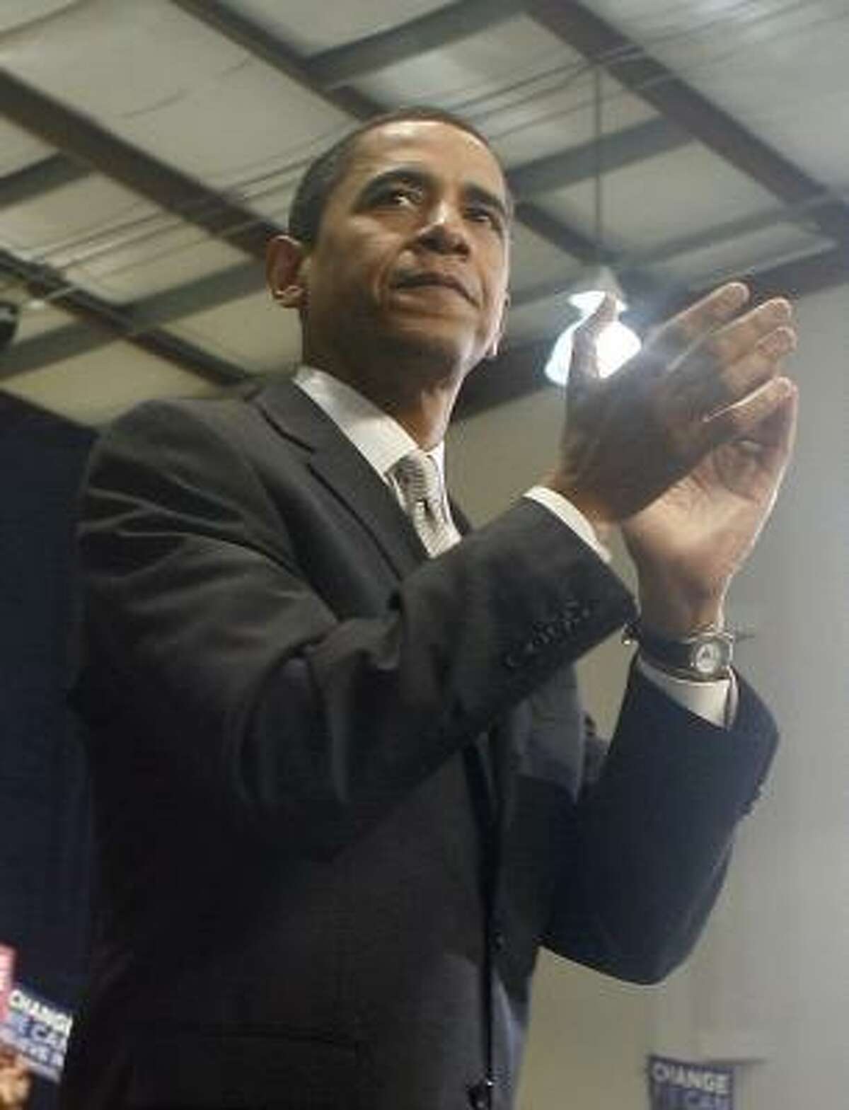 Obama heads north with a stop at Rhode Island College on Saturday.