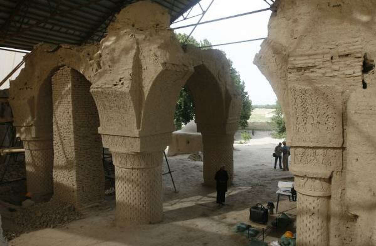 Afghan workers gather at the site in the Balkh province in Afghanistan to restore the ornate 9th century mosque of Noh-Gonbad or Nine Cupolas, the oldest and one of the finest examples in the world from that period. French archaeologists believe they have found a long-forgotten city there.