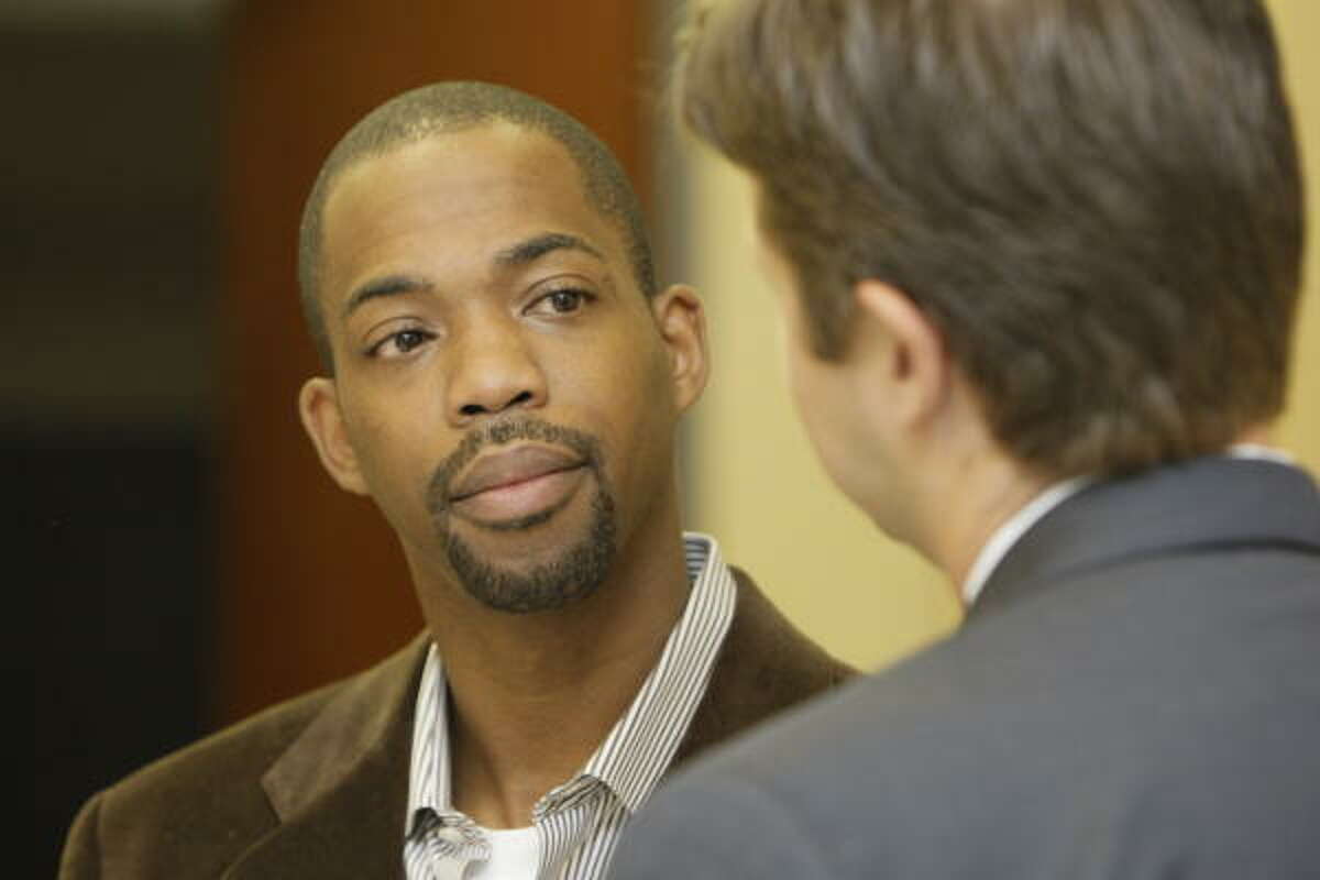 Houston Rockets guard Rafer Alston, left, talks with attorney Derek Hollingsworth after a brief court appearance on a DWI charge.