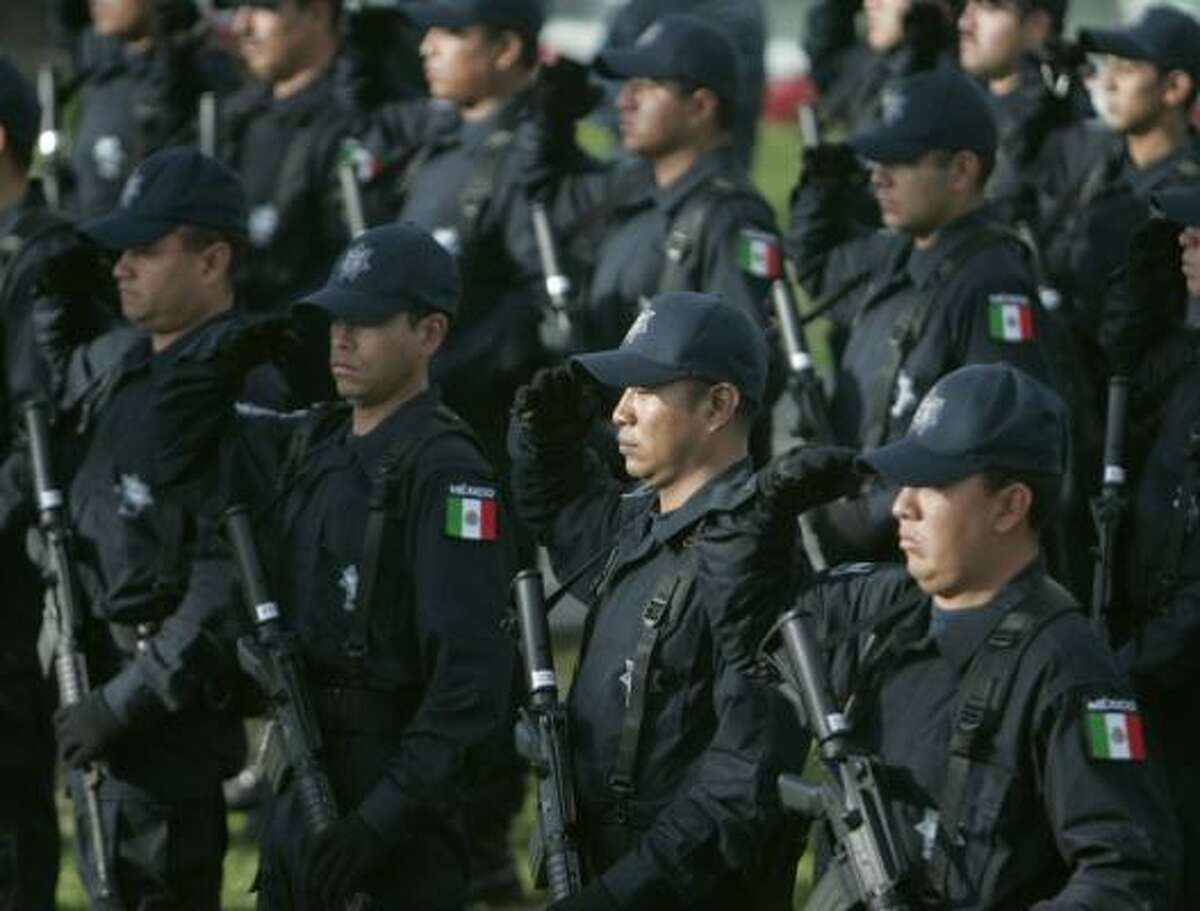 Mexican Federal Police honor Officer Miguel Zedillo during a ceremony at police headquarters in Mexico City. Zedillo was killed during a three-hour shootout last week in Tijuana.