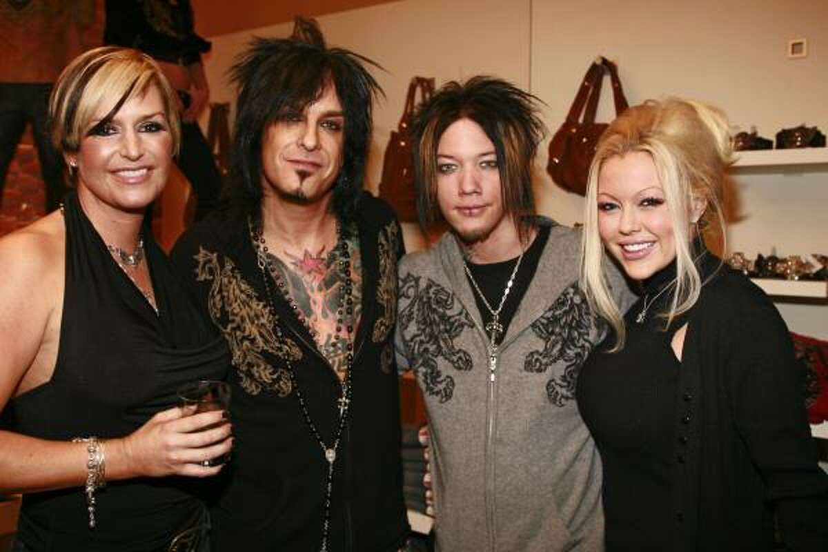 Kelly Gray, left, and Mötley Crüe bassist Nikki Sixx, second from left, appeared together at an Aspen boutique to promote their Royal Underground clothing line, which combines edgy styles with luxe fabrics.