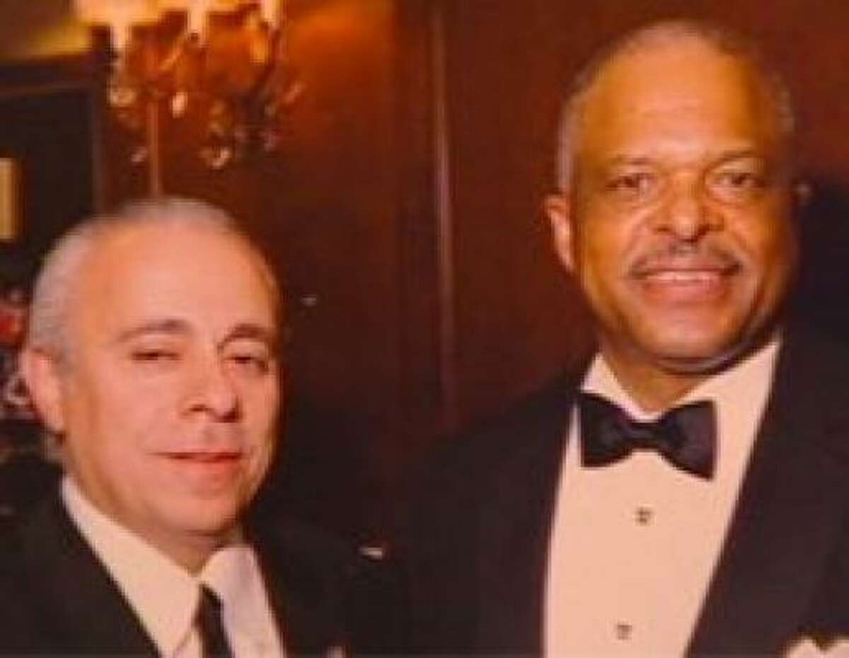 Houston Police Chief Harold Hurtt is pictured with Roland Carnaby at a policeman's ball last year. Hurtt said he doesn't know Carnaby but acknowledged he may have met him at a function.