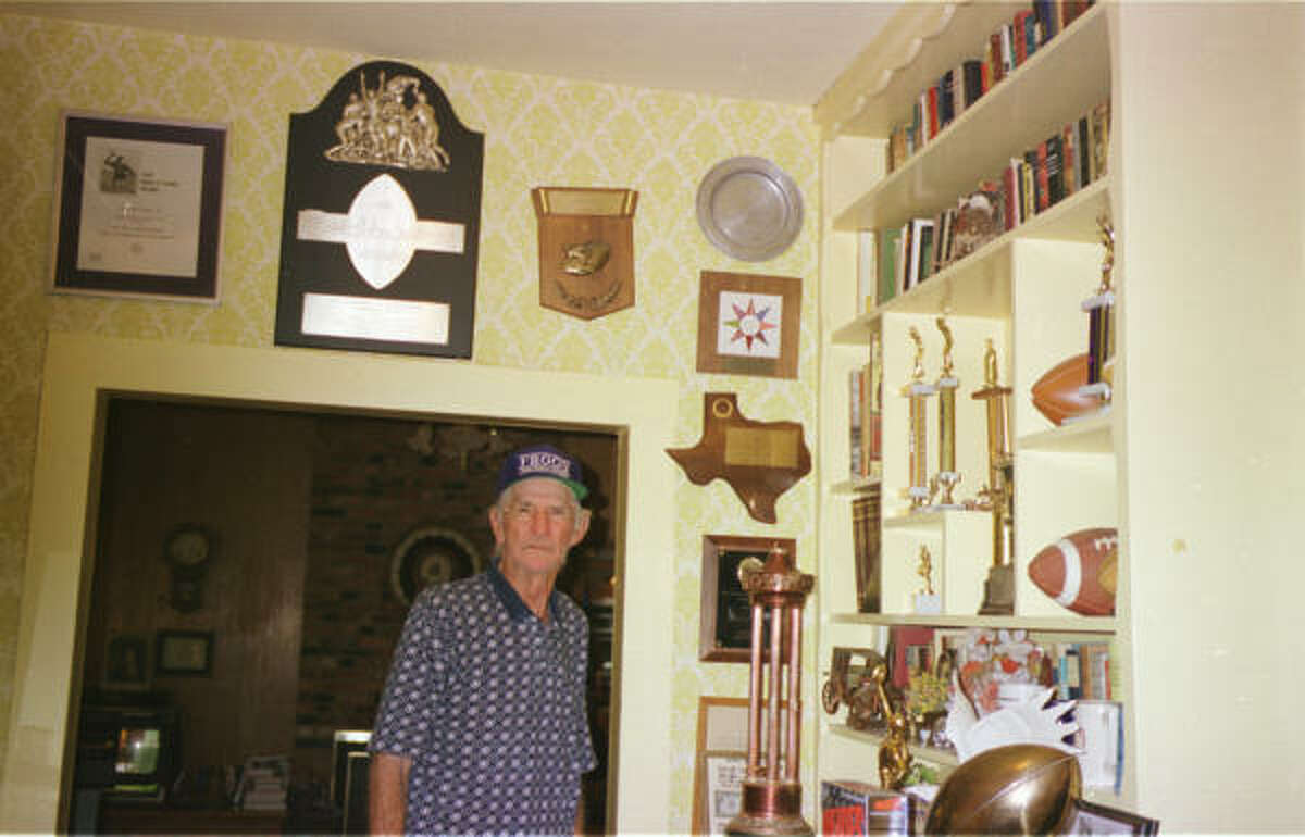 At right, the humble Sammy Baugh reluctantly showed John McClain his numerous awards at his home in Rotan in July of 1998.