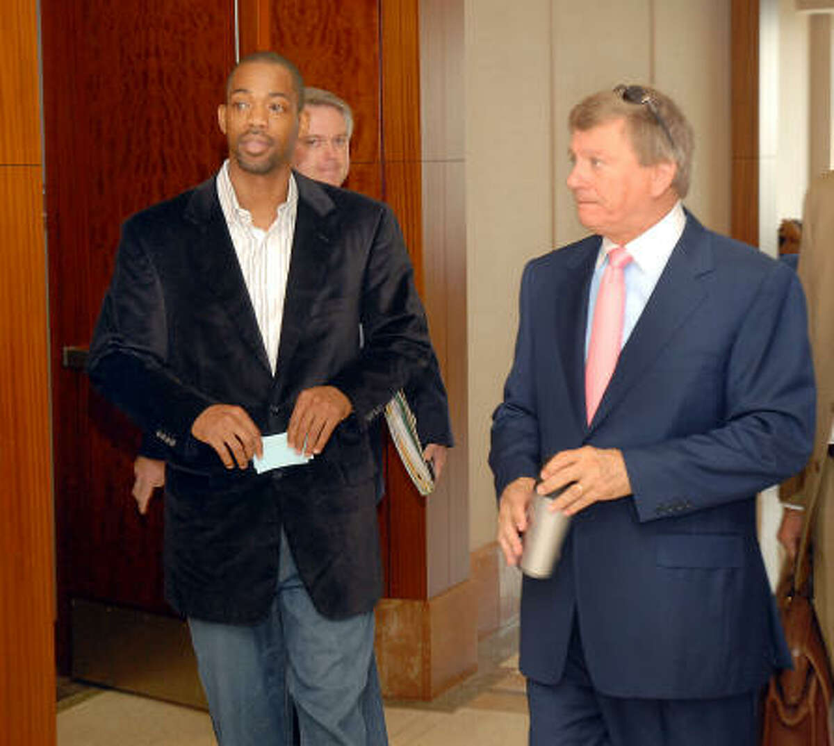 Houston Rockets guard Rafer Alston, shown leaving court last month with his attorney, Rusty Hardin, right, is set for trial in October on a drunken-driving charge.