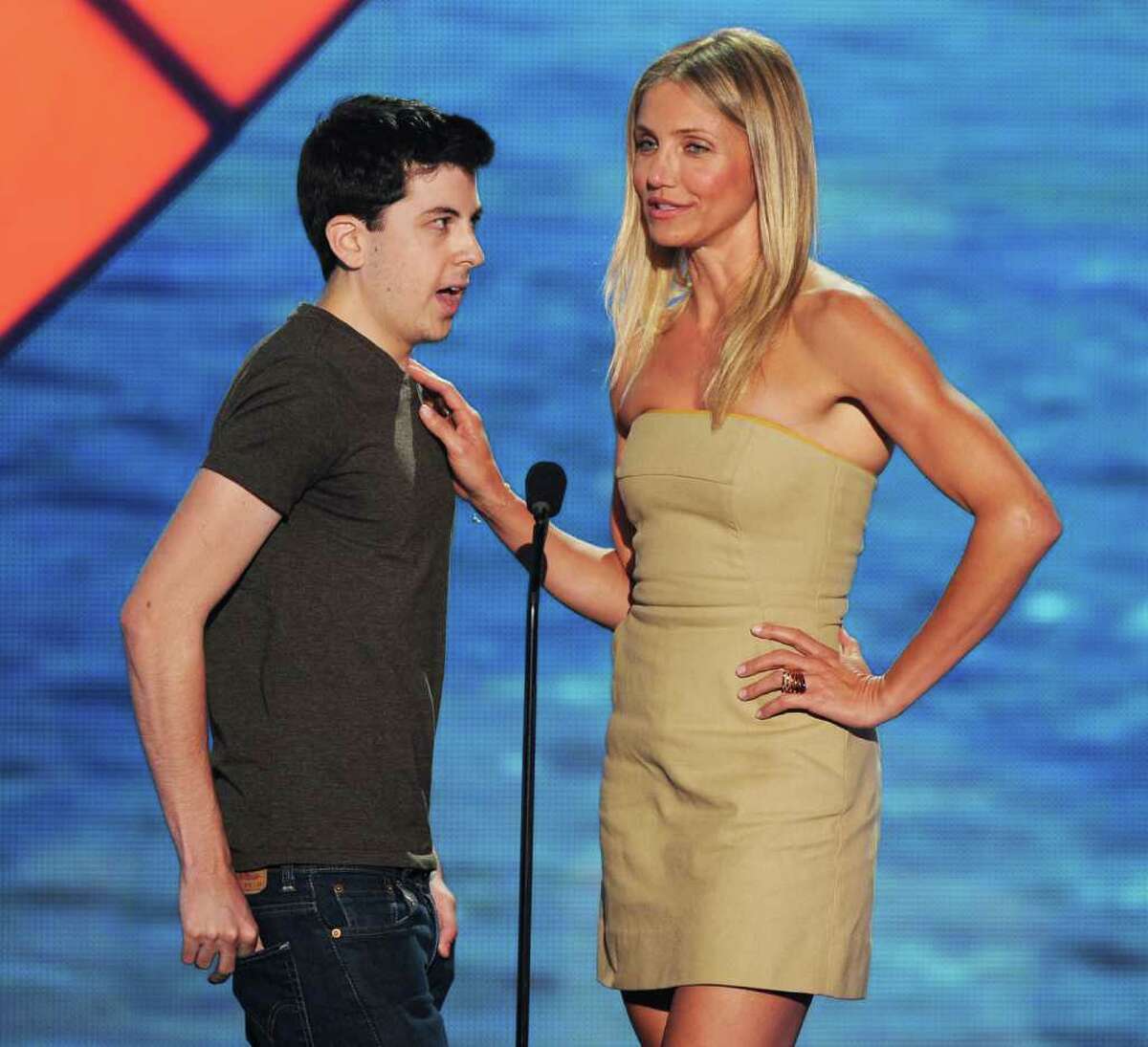 Actor Christopher Mintz-Plasse (L) and actress Cameron Diaz speak onstage during the 2011 Teen Choice Awards held at the Gibson Amphitheatre in Universal City, California.