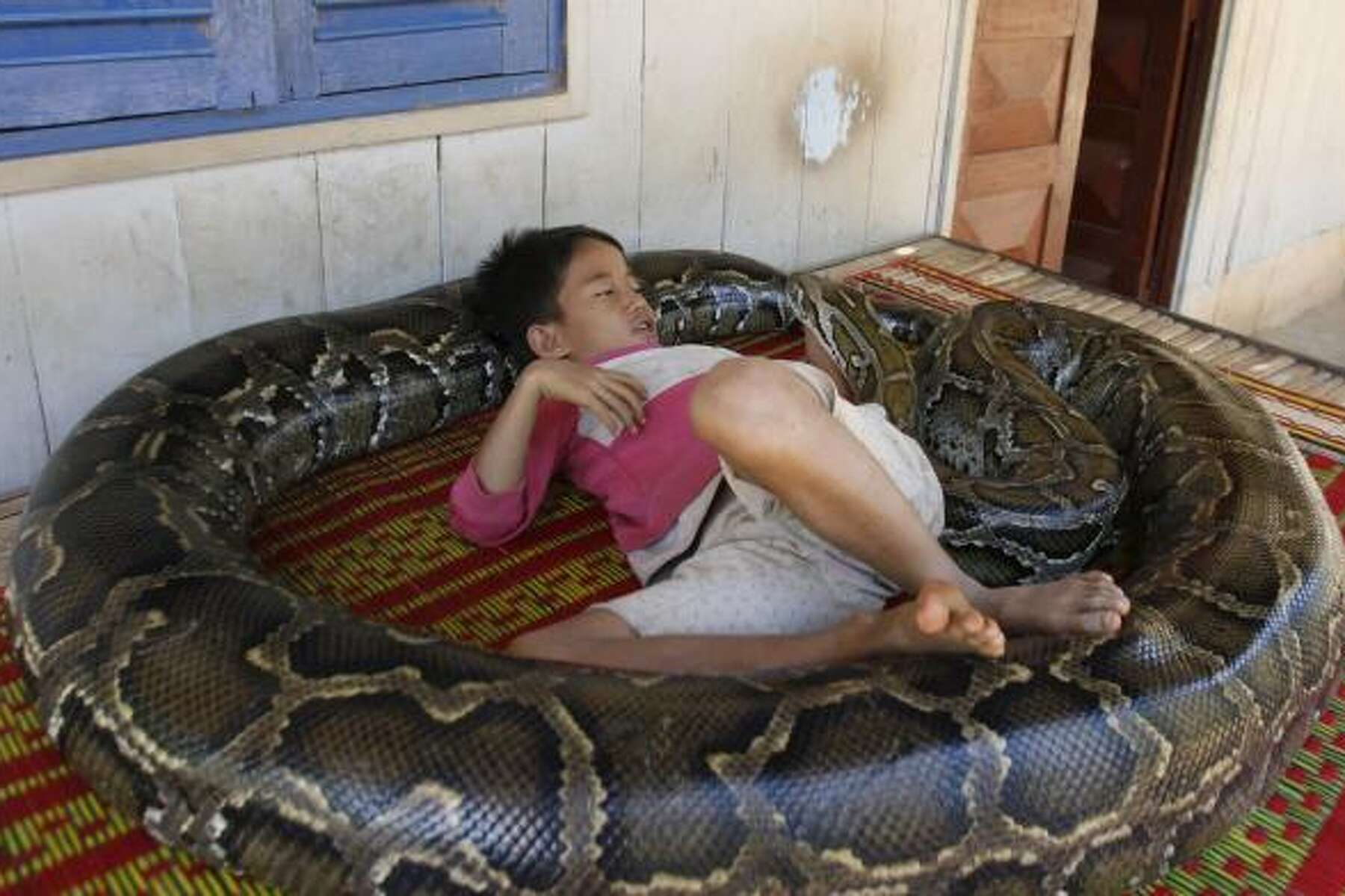 Boy Has A Special Bond With Huge Pet Python