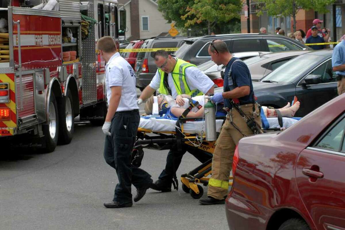 A victim from accident at Cafe Oo La La in the Ridgeway Shopping Center where Samuel Leighton, 92, drove into the restaurant in Stamford, Conn injuring 9 people on Monday August 8, 2011 is taken to the hospital.