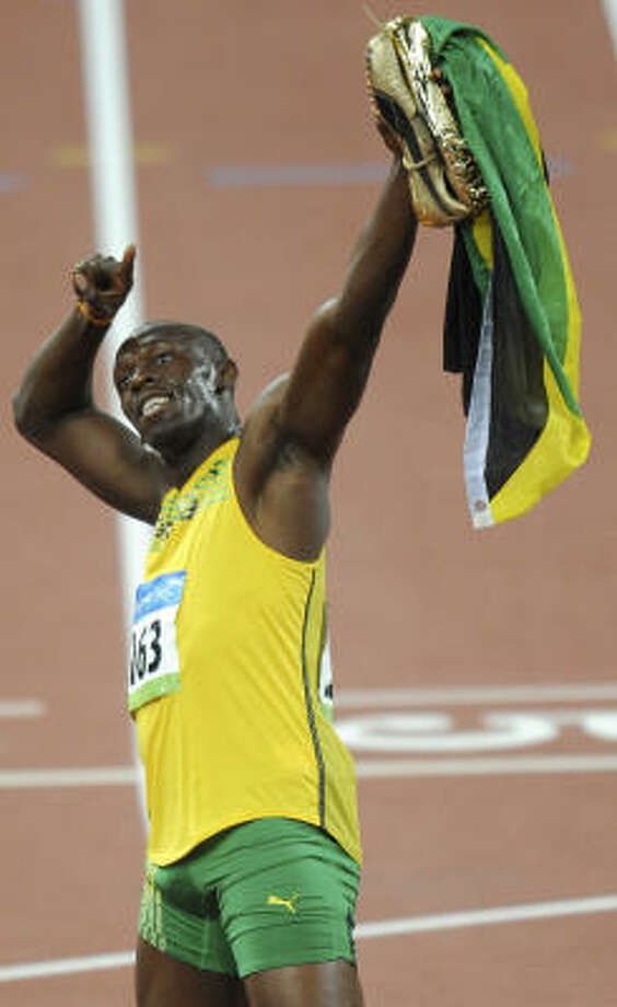 Jamaican sprinter Bolt wins men's 100 in record time - Houston Chronicle