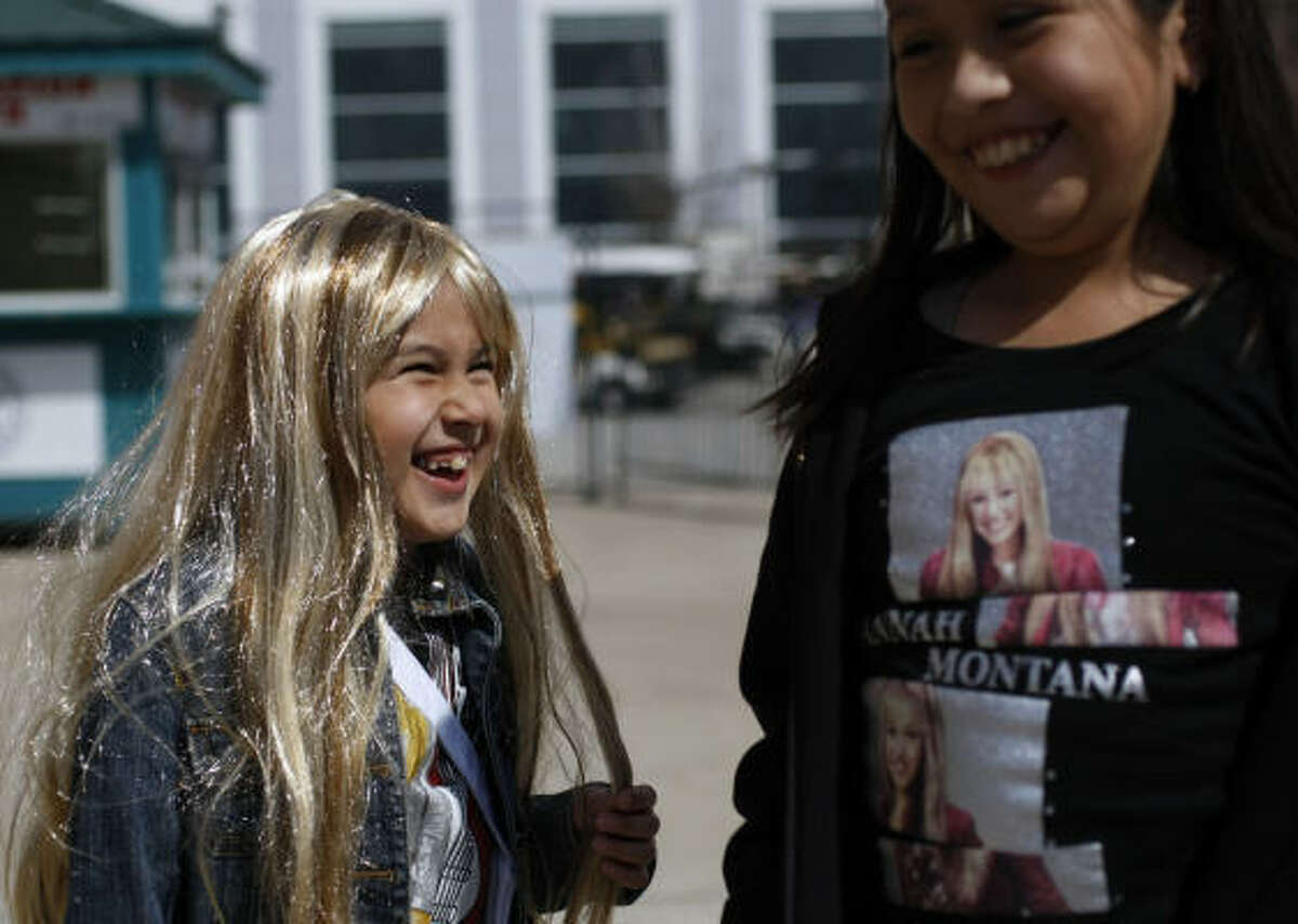 Hannah Montana/Miley Cyrus fans Brittany Garcia, left, and Desiree Gomez, 9, said they were excited about the Hannah Montana concert during the 76th annual Houston Livestock Show and Rodeo on Sunday.