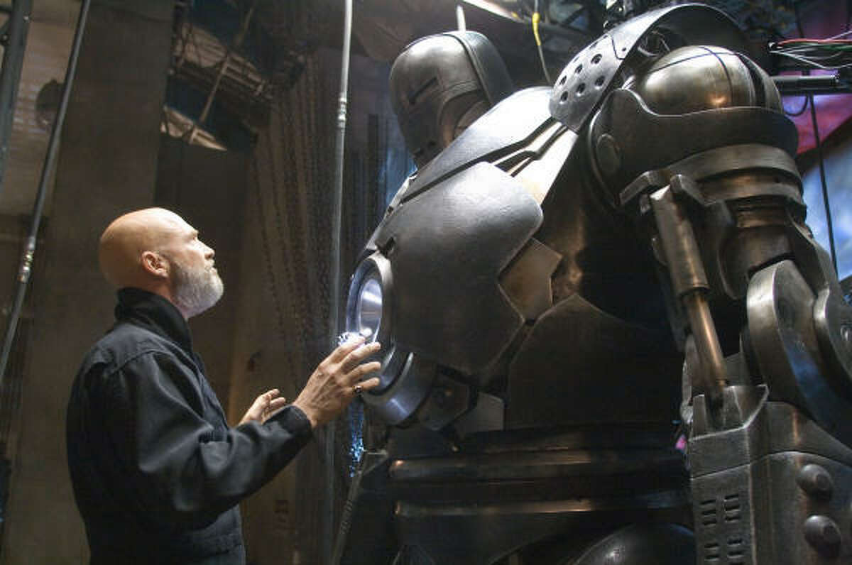 Obadiah Stane (Jeff Bridges) surveys the Iron Monger armor in Iron Man.