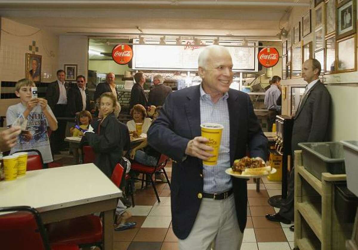 Celebrities Celebrities make "pit" stops at Kansas City barbecue joints. Here is Arizona Senator John McCain at Arthur Bryant's.