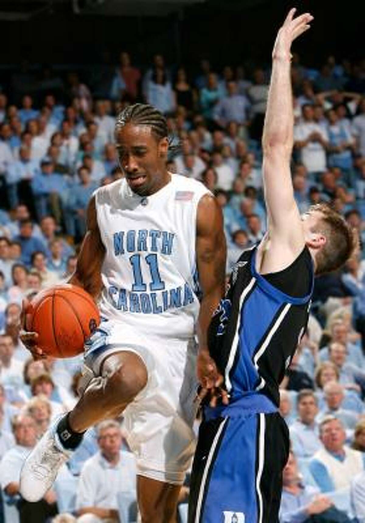 North Carolina's Quentin Thomas loses the ball while driving against Duke's Greg Paulus.