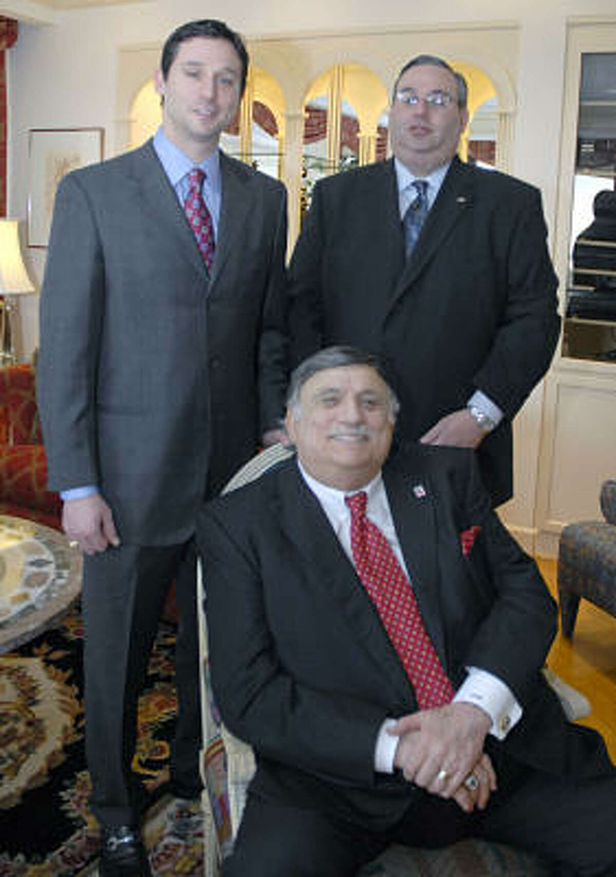 I.W. Marks is shown, seated, with sons, Bradley, left, and Daniel, at home in December 2006.