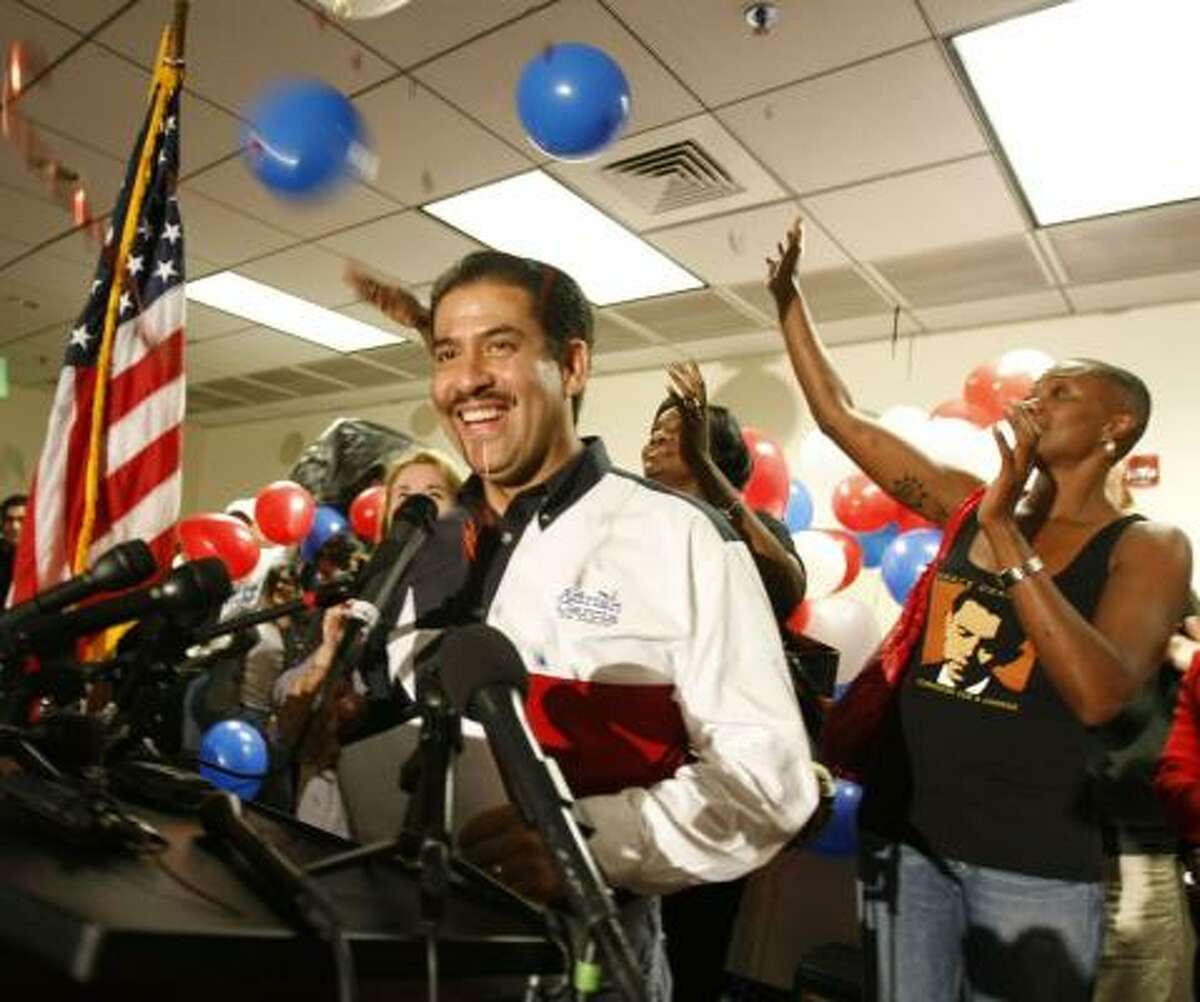Adrian Garcia addresses supporters at an election night party Tuesday at the Communications Workers of America 6222.