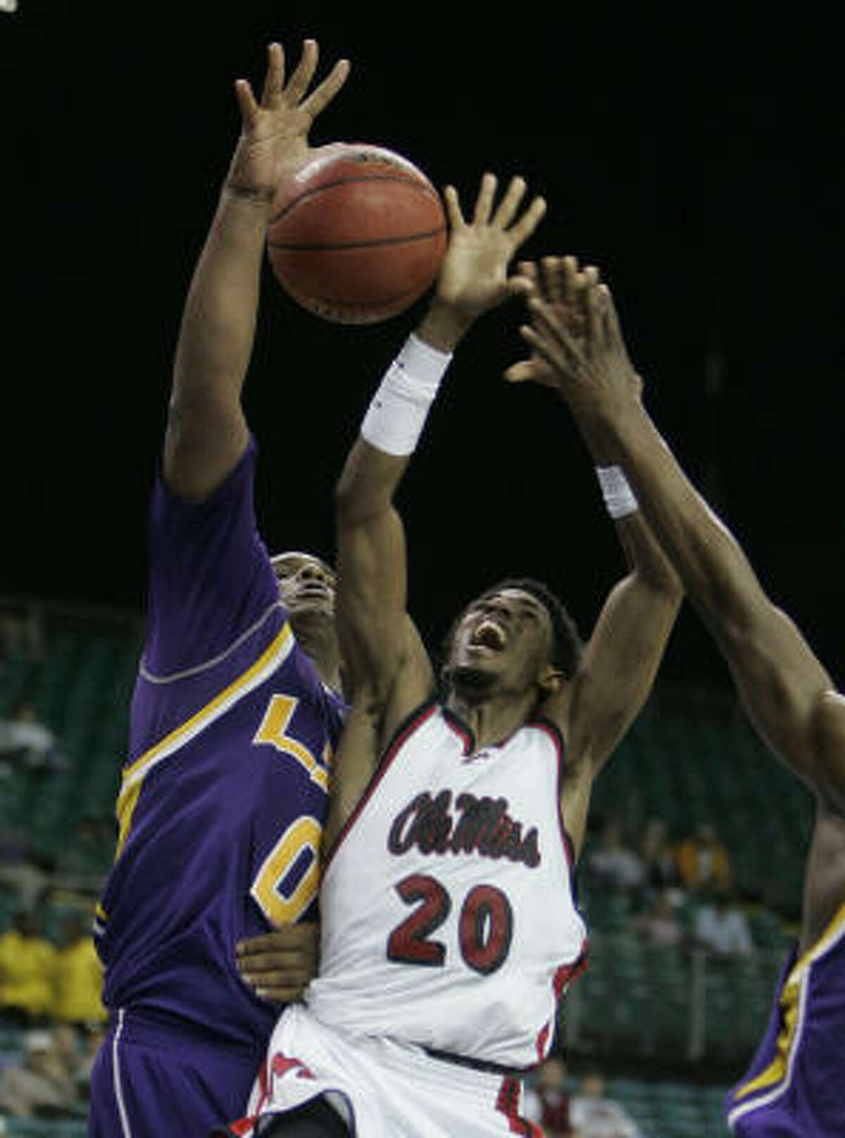 LSU's Glen Davis, left, tries to block the shot of Mississippi's Bam Doyne during their Southeastern Conference basketball tournament game at the Georgia Dome on March 9.