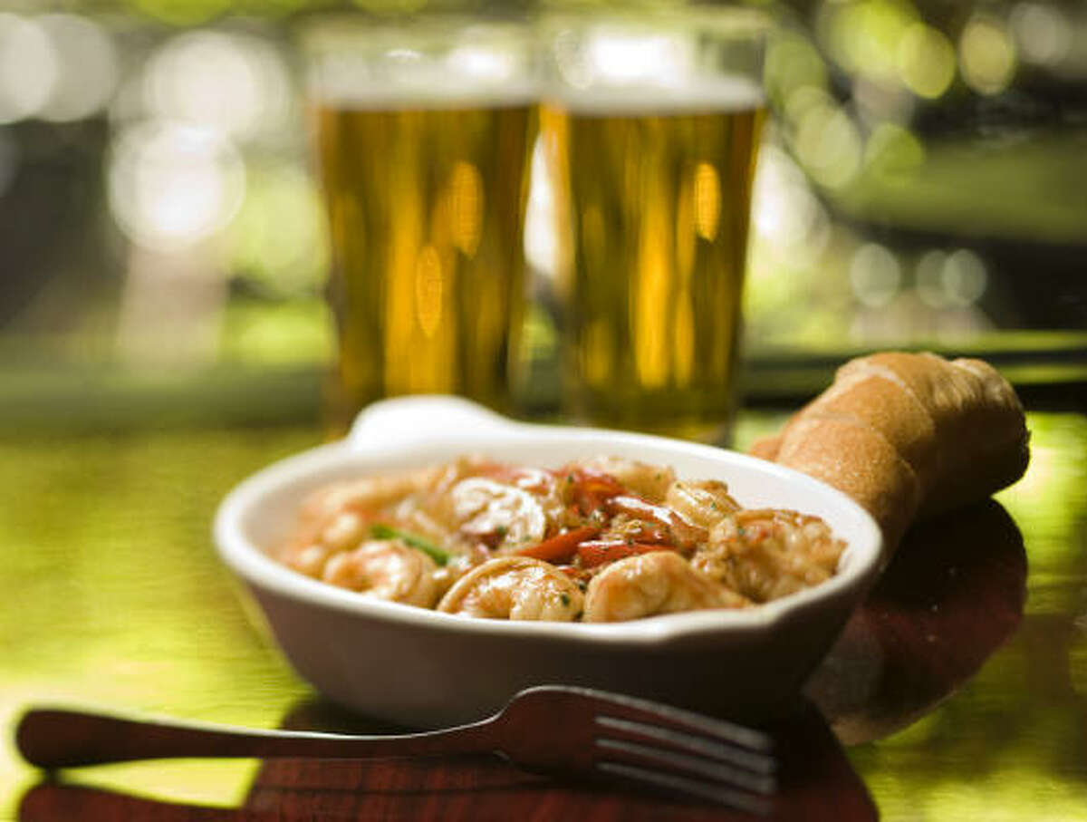Adding a splash of beer to dishes such as this New Orleans-style Barbecue Shrimp from Bistro Toulouse can punch up the flavor.
