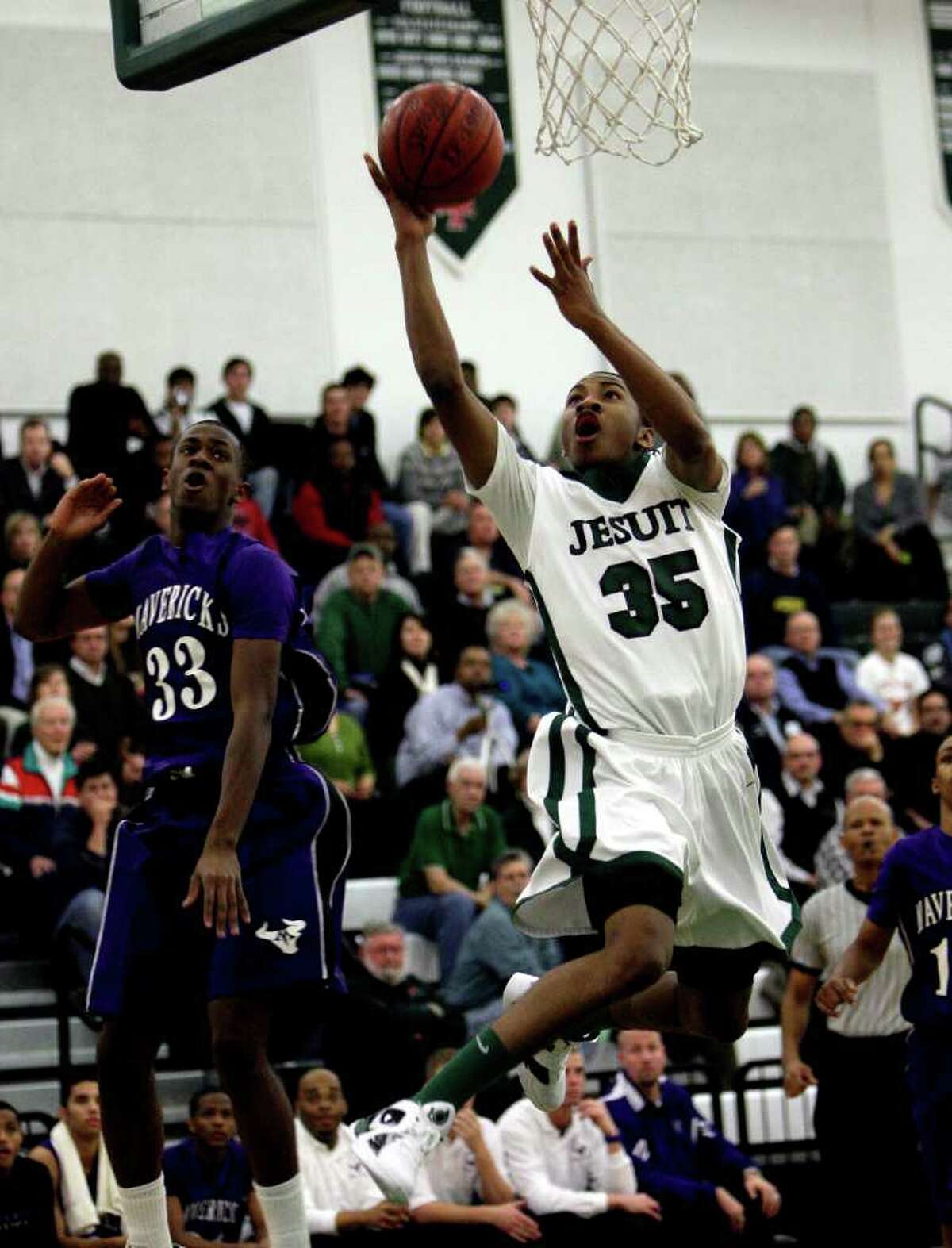 Strake Jesuit's Rasheed Sulaimon )35) drives to the basket around Morton Ranch's Chuck Anyasinti (33)during a basketball game between Morton Ranch and Strake Jesuit, Tuesday, Feb. 1, 2011. Strake Jesuit won 60-58 in double overtime.