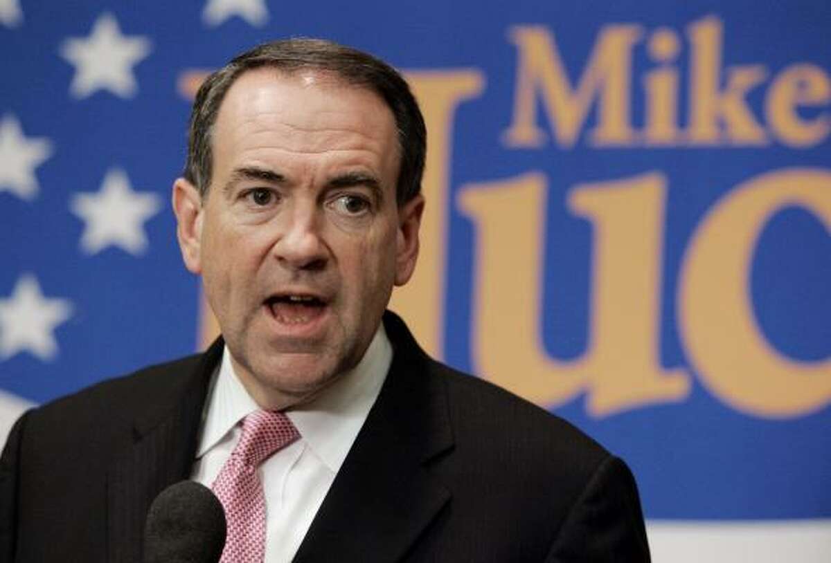 A new poll shows former Arkansas Gov. Mike Huckabee, shown in Dallas on Monday, second among GOP candidates, two percentage points behind Rudy Giuliani.