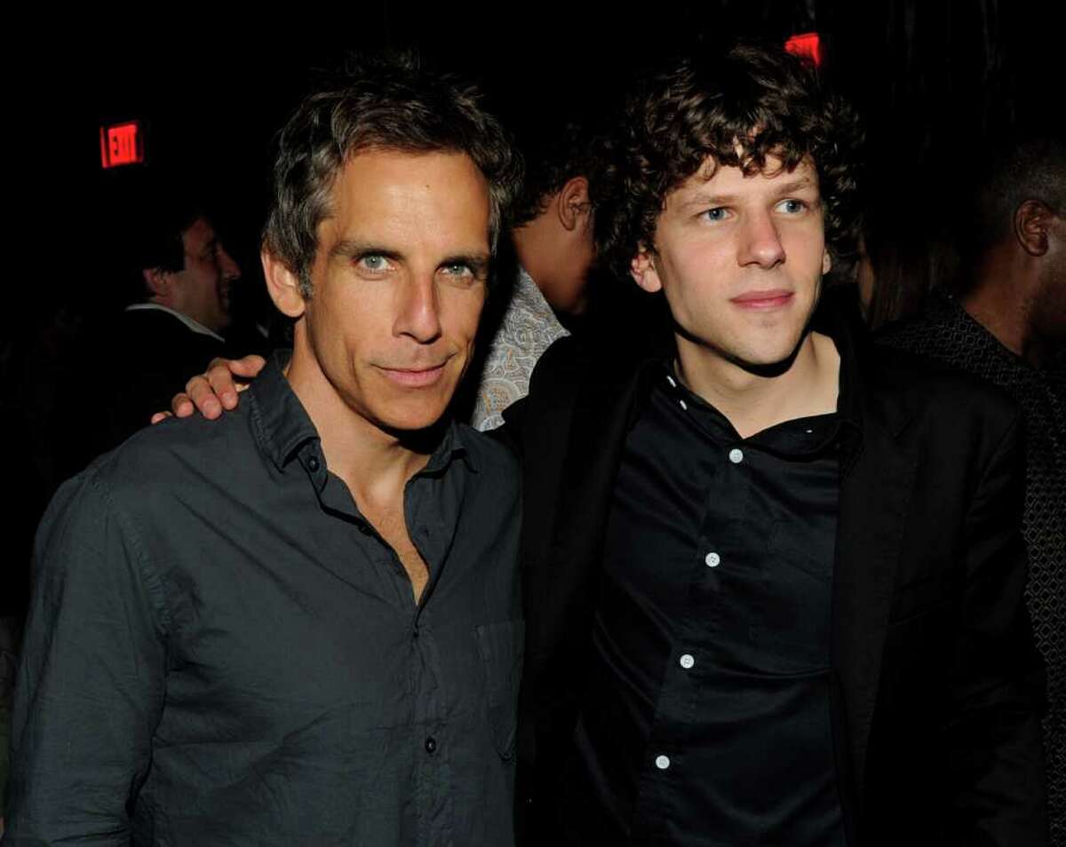 Producer Ben Stiller (L) and actor Jesse Eisenberg pose at the after party for the premiere of Columbia Pictures' "30 Minutes or Less" at the Rolling Stone Restaurant in Los Angeles, California.