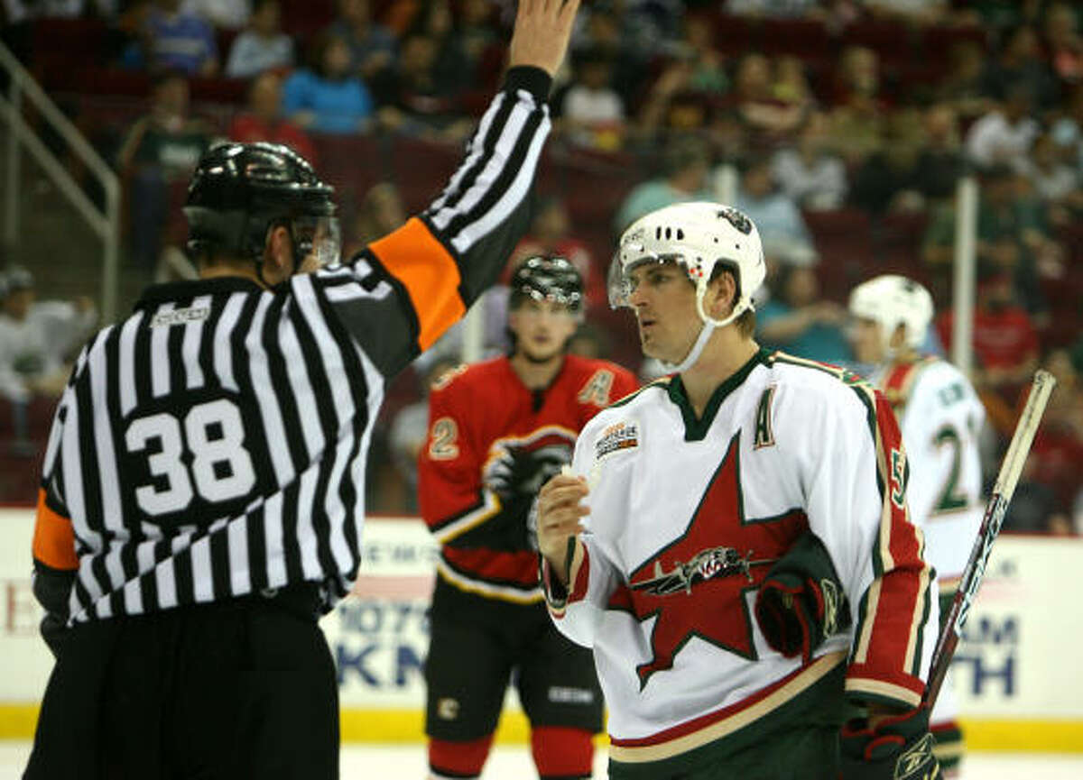 Erik Reitz consults with referee Francois St. Laurent. The Aeros were hit with 38 minutes in penalties, compared with 12 for Omaha.