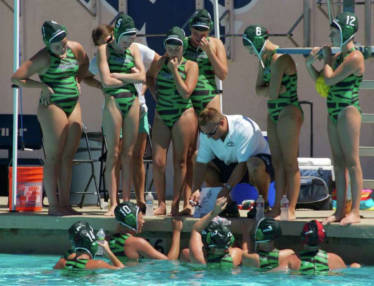 Greenwich Water Polo U-14 coach Brian Kelly gives some pointers to his team during Thursday's action in California.