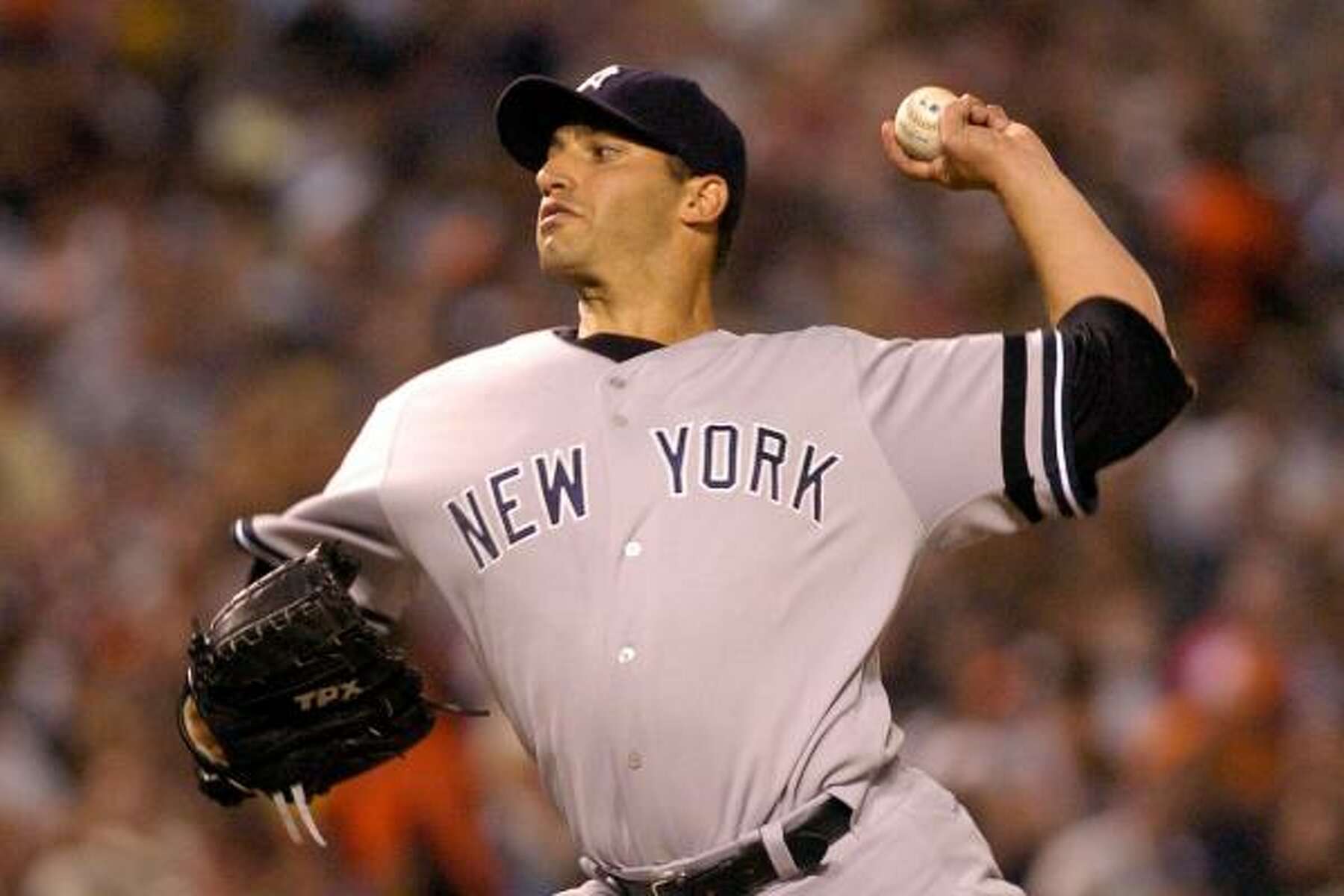 New York Yankees' Andy Pettitte yells into his glove as he walks off  News Photo - Getty Images