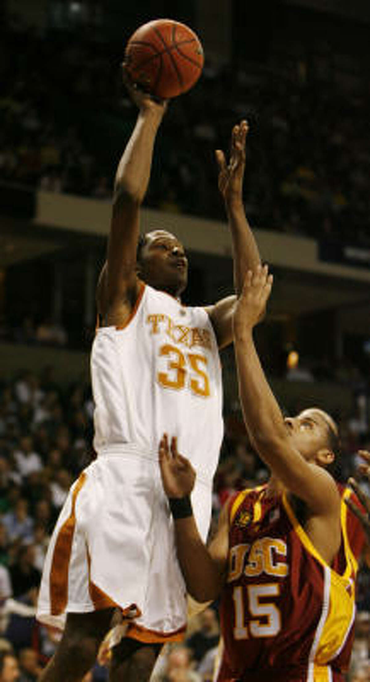 Texas' Kevin Durant (35) goes up over USC's Dwight Lewis in the first half of Sunday's East Regional game at Spokane, Wash. Durant scored 30 points and had nine rebounds, but it wasn't enough as the fifth-seeded Trojans breezed past the No. 4 Longhorns 87-68.